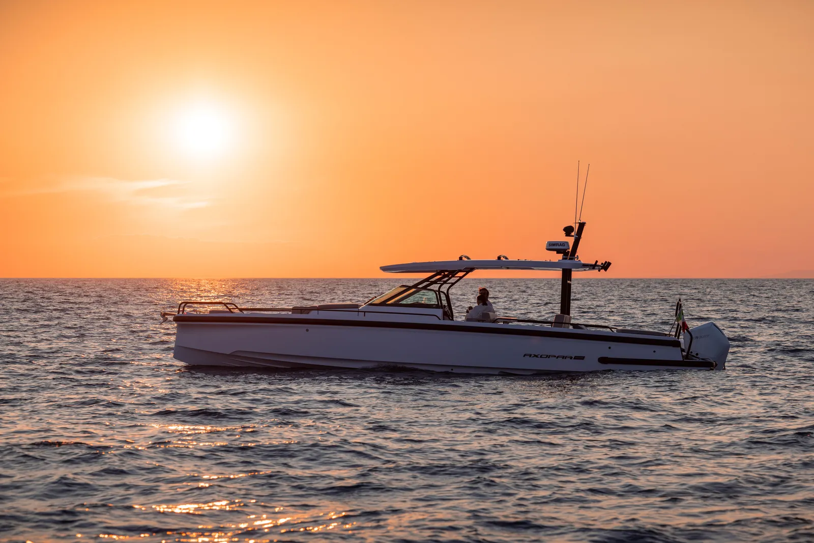 Modern Axopar 37 speedboats navigating the deep blue waters along the beautiful Cretan coastline.
